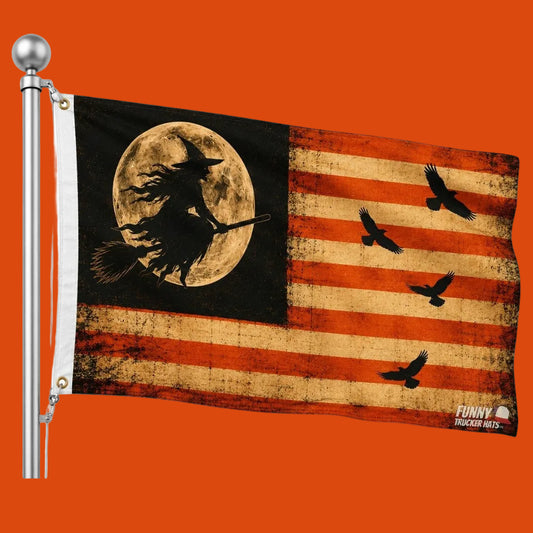 A Halloween-themed flag featuring a distressed American flag design with a black canton, a full moon and witch silhouette, and four black crows over red and beige stripes. The flag is shown attached to a silver flagpole against a plain white background.