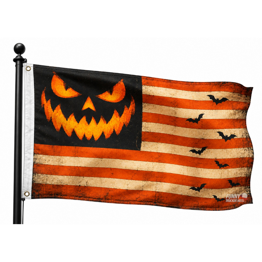 A Halloween-themed American flag featuring a jack-o'-lantern face in the canton and distressed orange and beige stripes, with black bats flying across the field. The flag is mounted on a black pole against a plain white background.